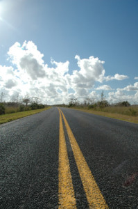 A two lane road runs through the heart of the Florida
